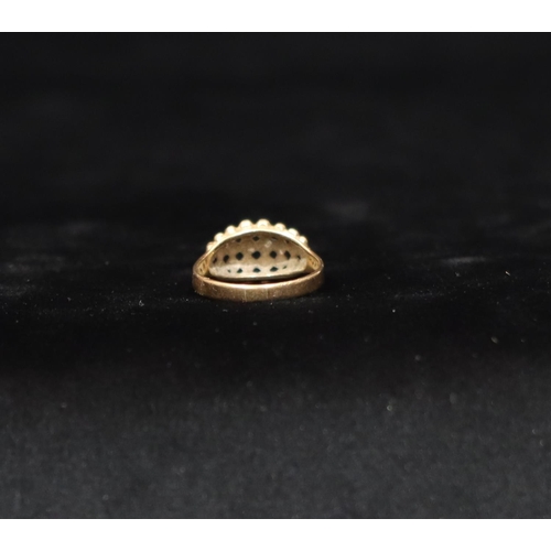 442 - A 9ct gold cluster ring with raised ball and pierced decoration, Size R/S, 3.6 grams