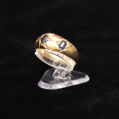 444 - A 9ct gold ladies' ring set with 3 sapphires, Size M/N, 3.4 grams gross