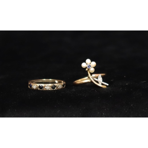 450 - A 9ct gold ladies' ring with floral motif inset with small sapphire, diamond chips and half pearls (... 