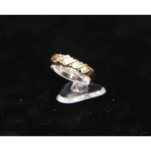 453 - A 9ct gold ladies' ring set with 5 small diamonds, Size L/M, 2.9 grams