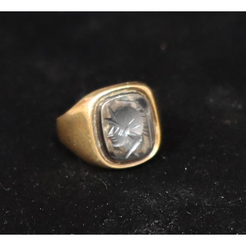 457 - A 9ct gold gentlemen's signet ring with carved figurehead of a gentleman, Size J, 3.7 grams gross