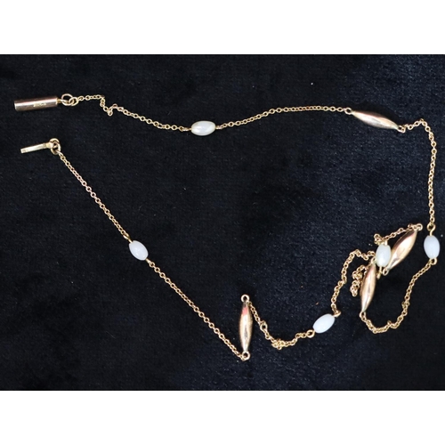 463 - A 9ct gold chain mounted with 5 pearl style beads, 44.5cm long, 2.9 grams gross