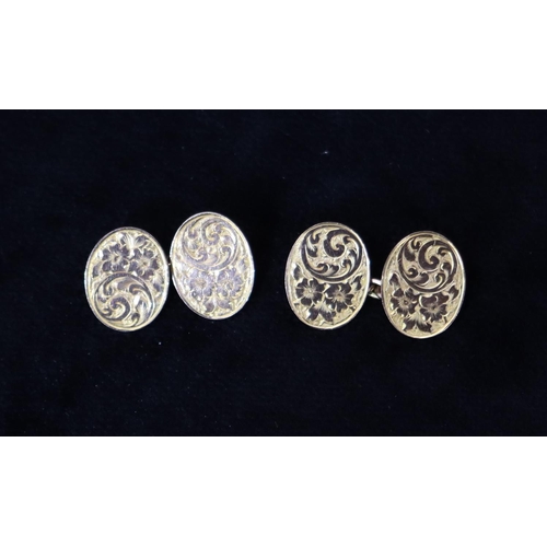 475 - A pair of 9ct gold oval gentlemen's cufflinks with chased and scroll decoration, 4.9 grams