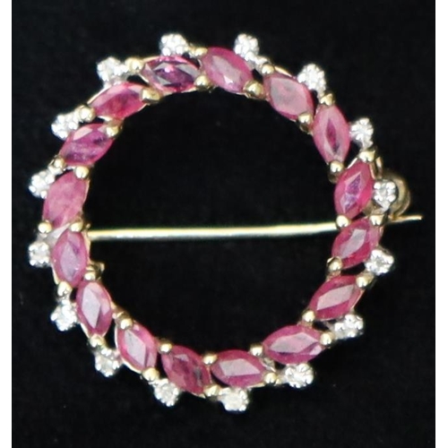 480 - A 9ct gold Garland brooch set with small rubies and diamonds, 2.7cm diameter, 3 grams gross