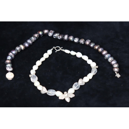 486 - A modern silver and large cultured pearl necklace with B motif, a modern black cultured pearl bead n... 