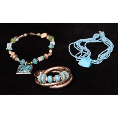 487 - A turquoise and silver multi bead necklace, a silver coloured metal and turquoise expanding bracelet... 