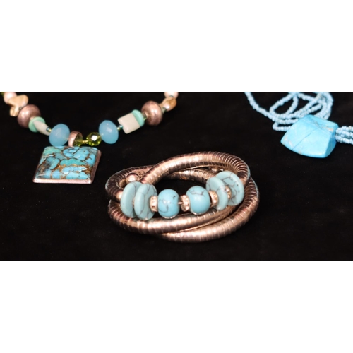 487 - A turquoise and silver multi bead necklace, a silver coloured metal and turquoise expanding bracelet... 