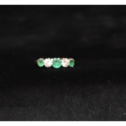 507 - An 18ct gold ladies' 5-stone ring set with 3 emeralds interspersed by 2 diamonds, diamonds approx. 0... 