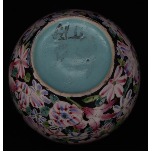 51 - An Oriental round bulbous thin neck vase on black ground with multicoloured floral and leaf decorati... 