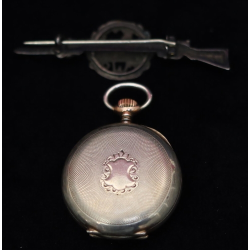 544 - An 800 silver coloured metal fob watch with white enamel dial and Roman numerals, allover engine tur... 