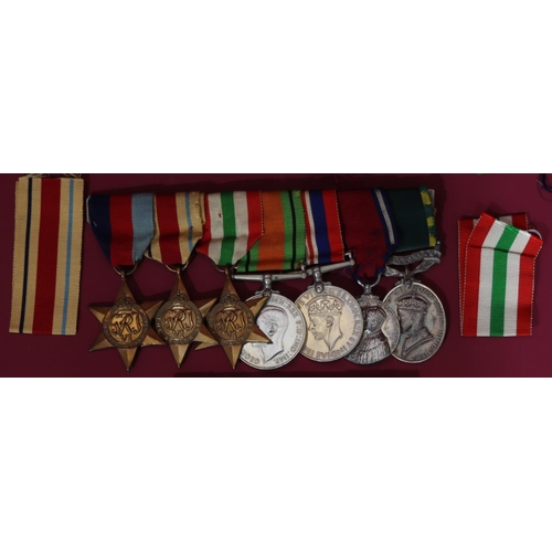 562 - A bar of 7 WWII medals, 1939/45 medal, Defence medal, Territorial Army Efficient Service medal 