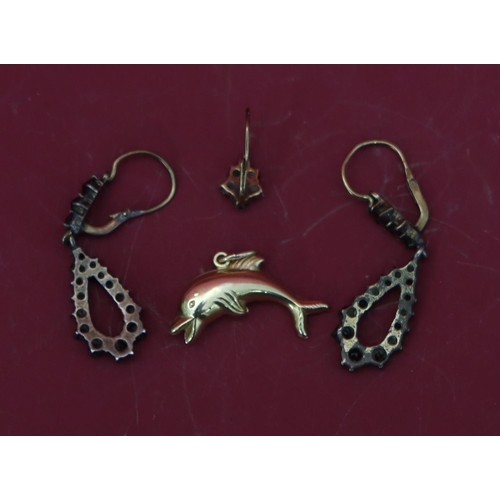 566 - A 14ct gold charm in the form of a dolphin, 1 gram, a pair of garnet drop earrings and a single garn... 