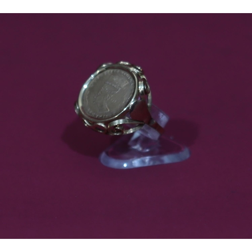 568 - A ladies' gold ring set with Egyptian coin with pierced shoulder, Size L/M, 2.2 grams