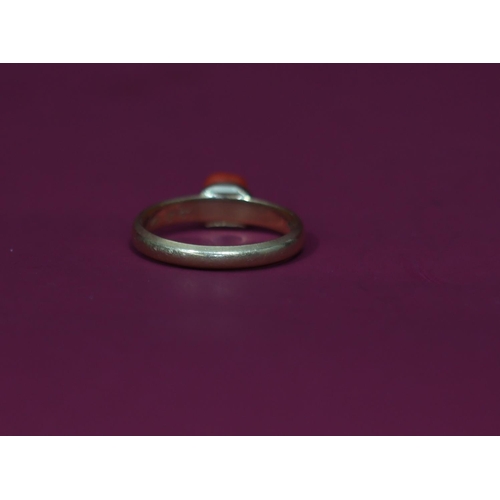 569 - A 14ct gold ring set with coral, Size O/P, 2.9 grams gross