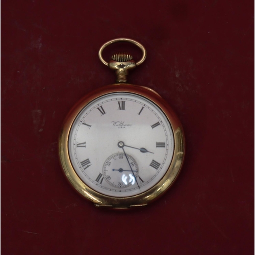 575 - A Waltham gold plated open faced pocket watch with white enamel dial, seconds dial and Roman numeral... 