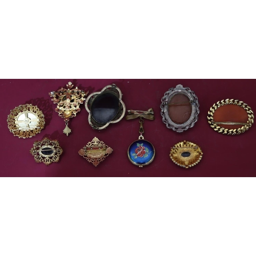 596 - 2 cameo style brooches, 7 various brooches and a fob watch (10)