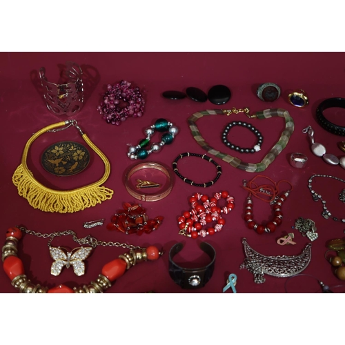 630 - A quantity of various costume bangles etc.