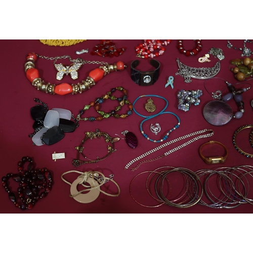 630 - A quantity of various costume bangles etc.