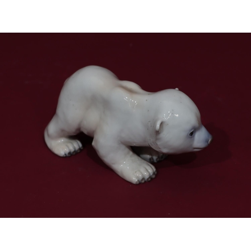 64 - A Royal Copenhagen china figure of a polar bear, numbered 535, 16.5cm long