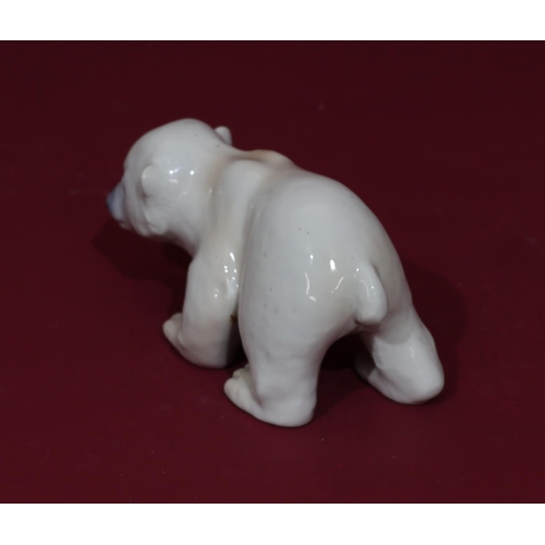 64 - A Royal Copenhagen china figure of a polar bear, numbered 535, 16.5cm long