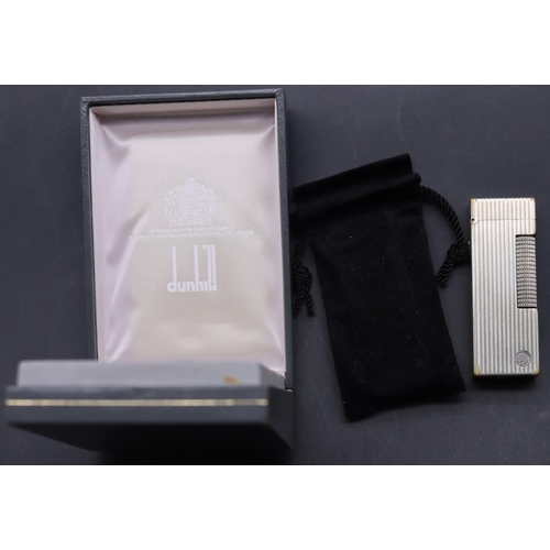 642 - A Dunhill reeded lighter (boxed)