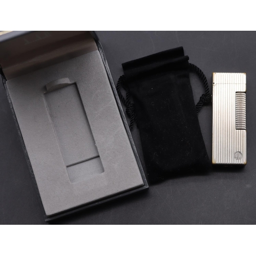 642 - A Dunhill reeded lighter (boxed)