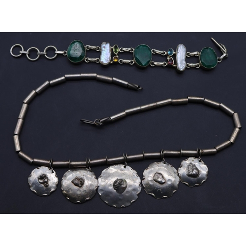 646 - A Continental necklace with 5 graduated circular drops, a silver coloured metal bracelet, mounted wi... 