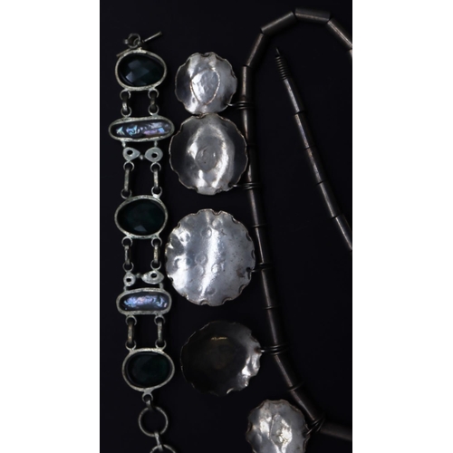 646 - A Continental necklace with 5 graduated circular drops, a silver coloured metal bracelet, mounted wi... 