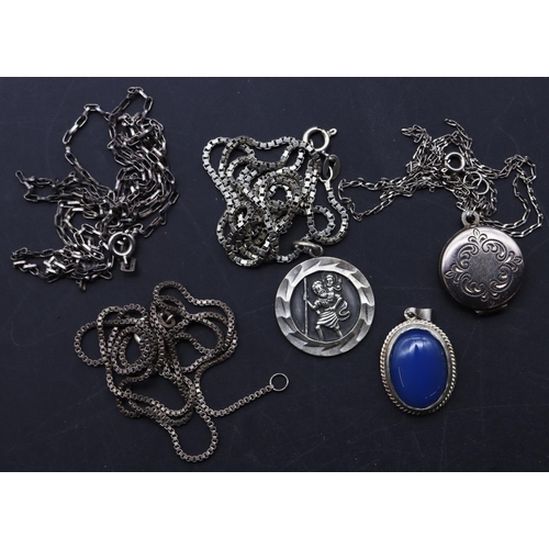 647 - A silver St Christopher with chain, a silver small locket with chain, a small oval pendant set with ... 