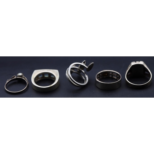 649 - A 925 silver twist ring, 4 silver rings, 35 grams gross (5)