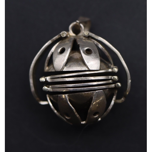 651 - A Mexican silver coloured metal ball shaped pendant with telescopic expanding centre