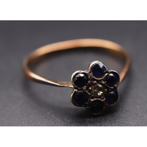 653 - A 9ct gold and silver small cluster ring set with clear and blue stones, Size P/Q