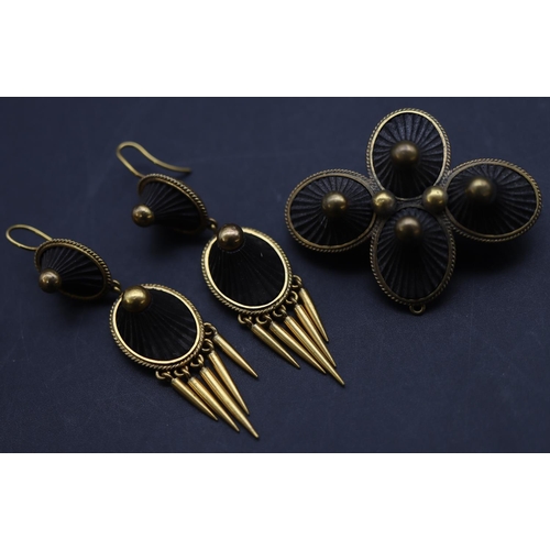 686 - A Victorian gold plated and jet 4-sectioned brooch, a pair of matching drop earrings with tassels