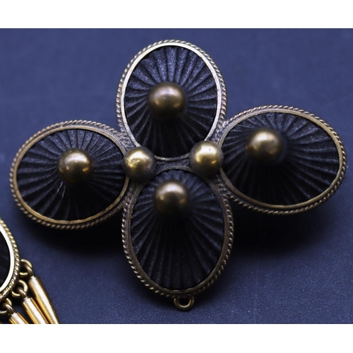 686 - A Victorian gold plated and jet 4-sectioned brooch, a pair of matching drop earrings with tassels