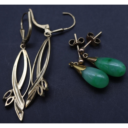 693 - A pair of gold and jade drop earrings and a pair of gold earrings mounted with small sapphires (4)