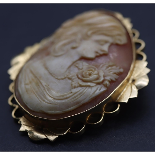 694 - A 9ct gold framed oval cameo figure of a lady, 5cm high, 10.7 grams gross