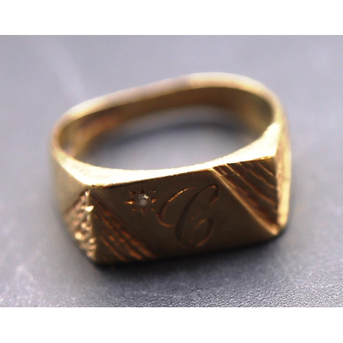 697 - A 9ct gold gentlemen's signet ring set with small diamond (shank dented), Size Q/R, 4 grams gross