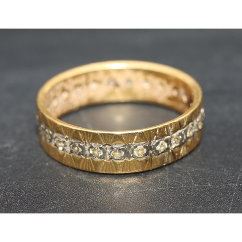 703 - A gold full eternity ring set with small diamonds, Size P, 4 grams gross