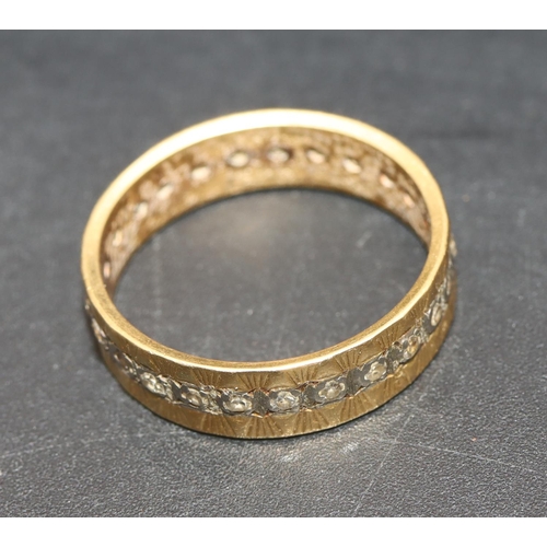 703 - A gold full eternity ring set with small diamonds, Size P, 4 grams gross