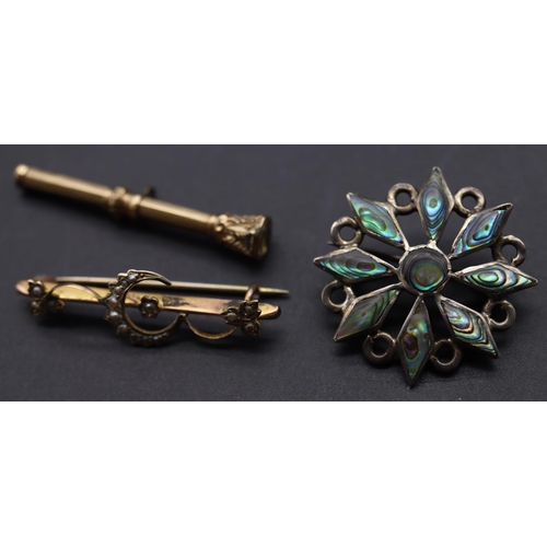 710 - A 9ct gold bar brooch with raised crescent moon and floral motif inset with half pearls, a pendant p... 