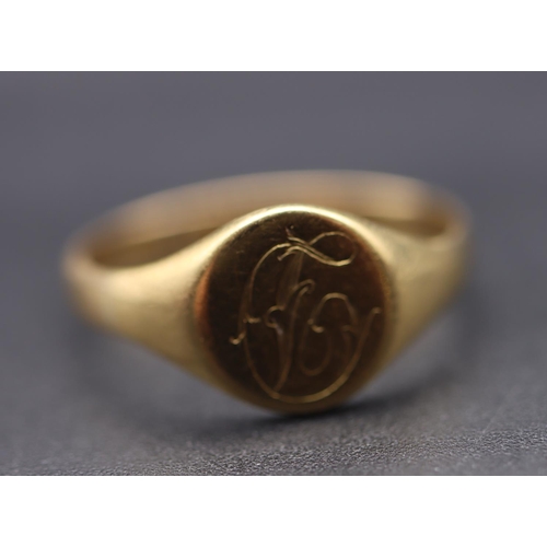 720 - An 18ct gold signet ring with engraved monogram, Size Q/R, 3.4 grams