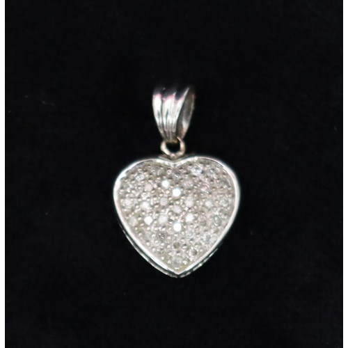 726 - A 9ct white gold heart shaped pendant set with small diamonds, 2.5cm high, 3.2 grams gross