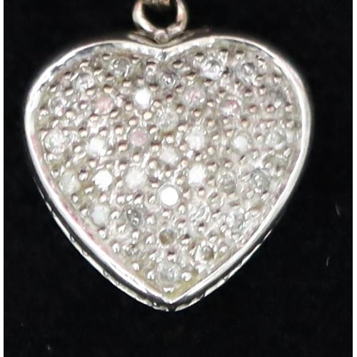 726 - A 9ct white gold heart shaped pendant set with small diamonds, 2.5cm high, 3.2 grams gross