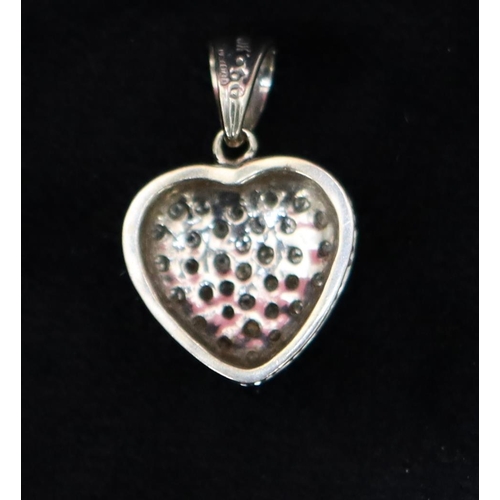 726 - A 9ct white gold heart shaped pendant set with small diamonds, 2.5cm high, 3.2 grams gross