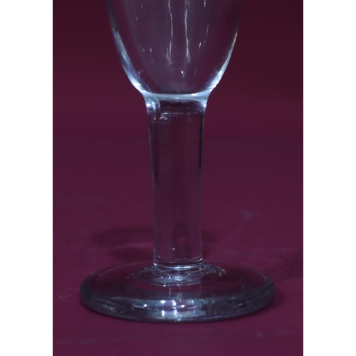 73 - An 18th Century plain stem wine glass with deceptive bowl and heavy ship's foot, 12cm high, circa 17... 