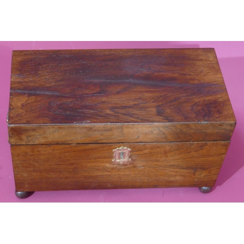 737 - A 19th Century rosewood rectangular shaped tea caddy with hinged lid enclosing 2 lidded compartments... 