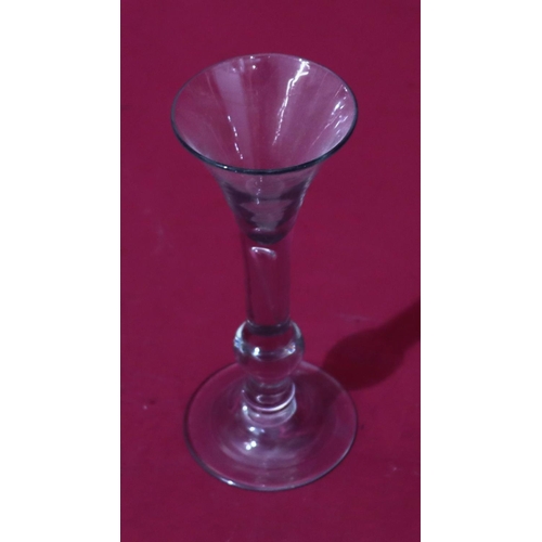 74 - An early 18th Century Balustroid wine glass with drawn trumpet bowl, ball knop and domed foot, circa... 