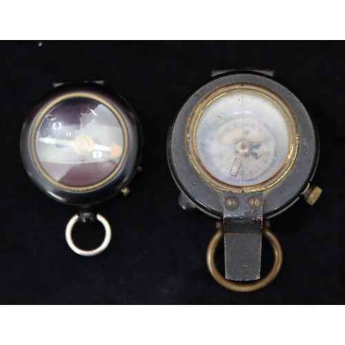 742 - Negretti & Zambra, London, black compass and a military brass and black compass (2)