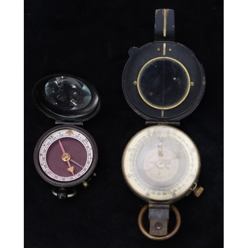 742 - Negretti & Zambra, London, black compass and a military brass and black compass (2)