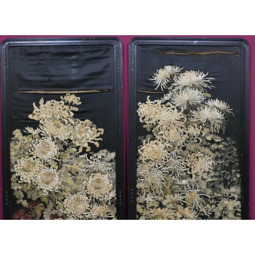 743 - A pair of Chinese black silk panels with allover floral and leaf decoration (some damage to silk), e... 